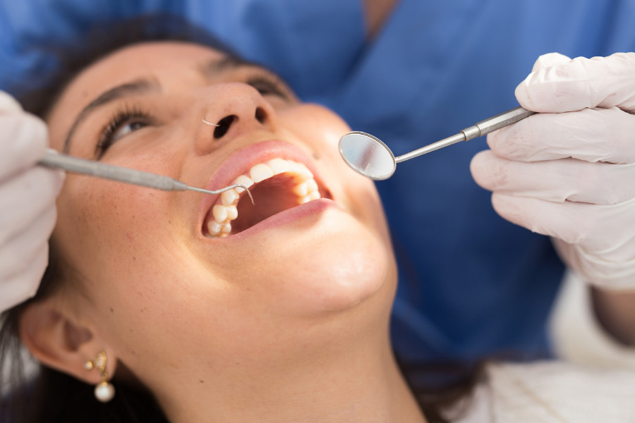 Adult woman receiving a dental cleaning