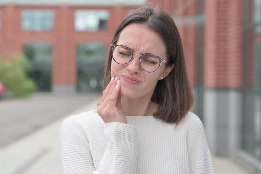 A woman experiencing a toothache