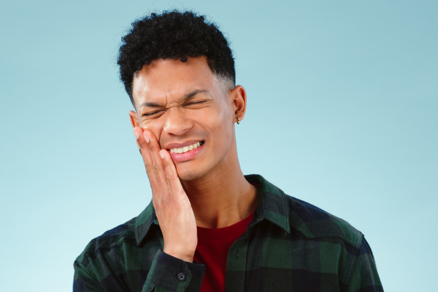 A man experiencing tooth pain